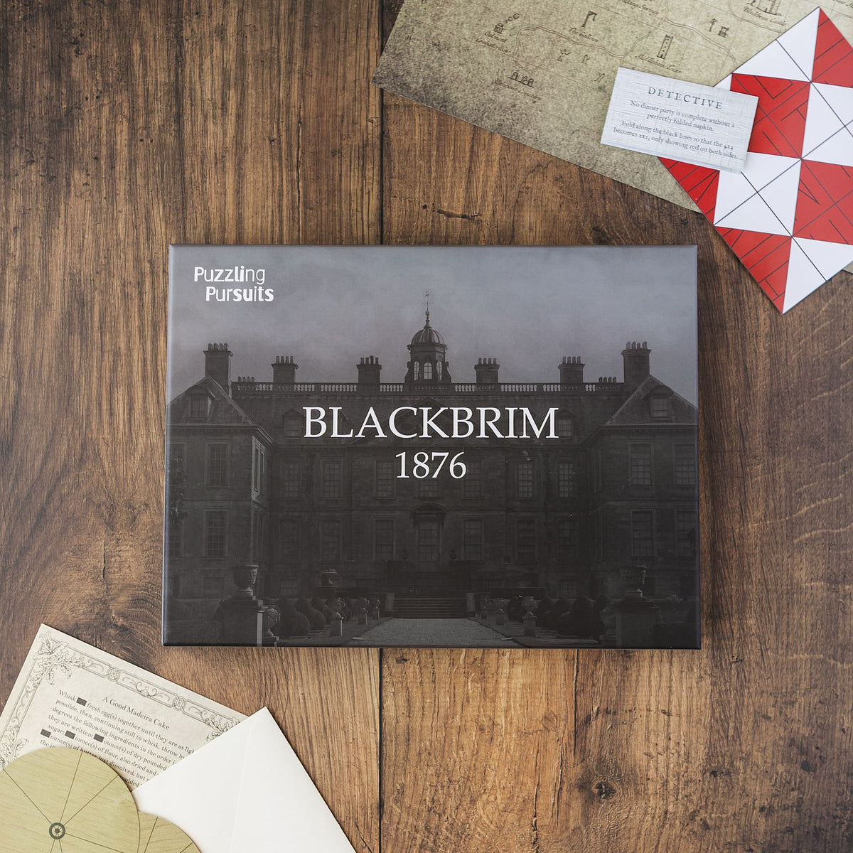 The Blackbrim: 1876 game box on a wooden table, a Victorian detective mystery played at home