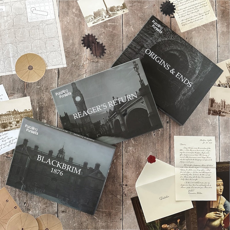 The Blackbrim Trilogy: the Blackbrim 1876, Reager's Return and Origins & Ends boxes on a wooden table with letters, a sealed envelope, cipher wheels and gears