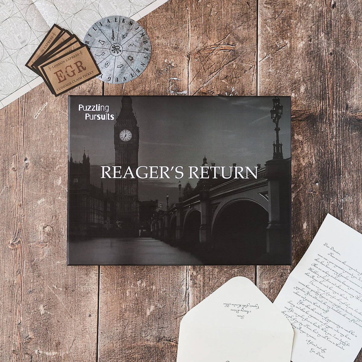 Reager's Return game box with materials on a wooden table